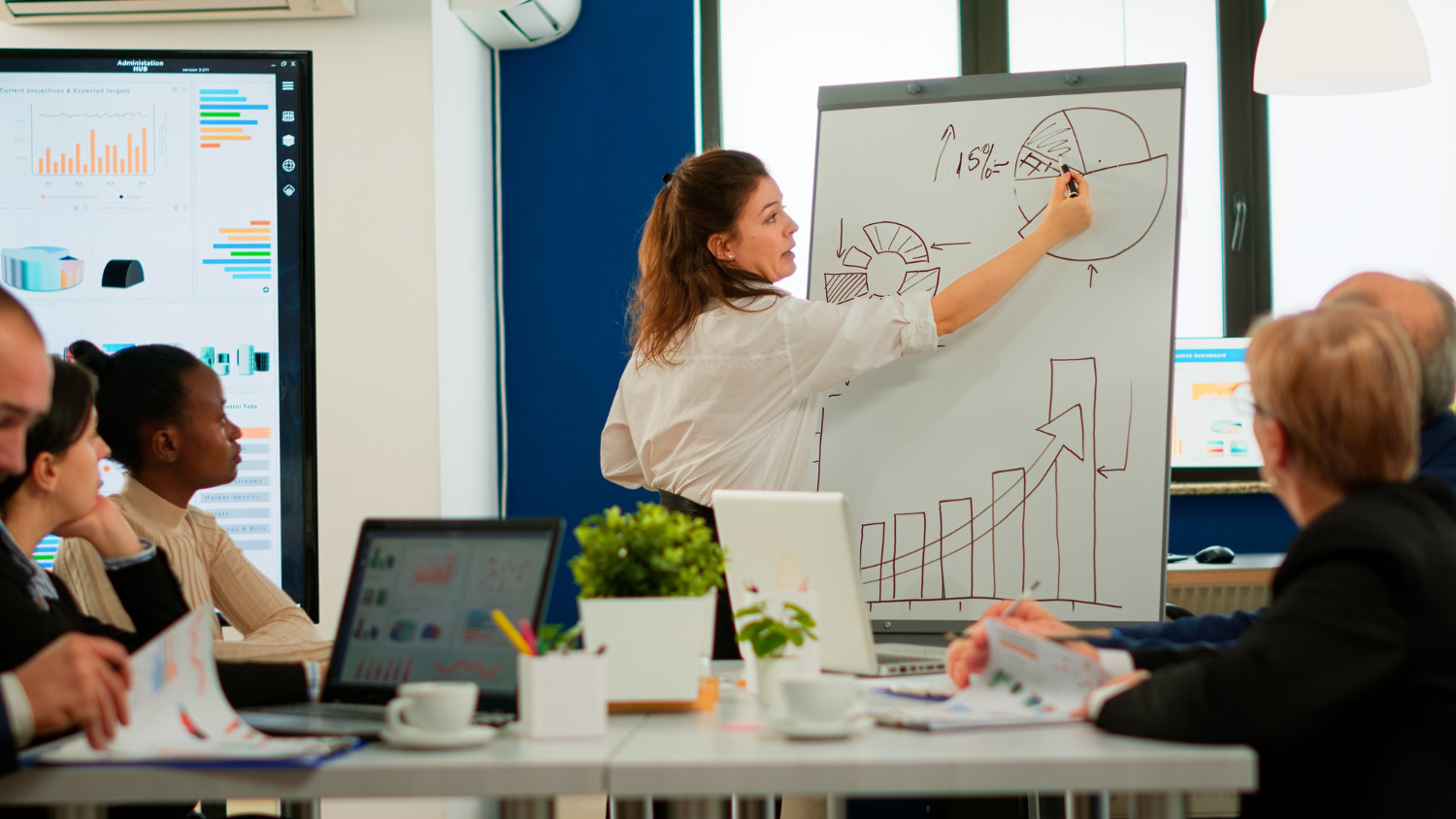 focused-team-leader-presenting-marketing-plan-to-interested-multiracial-coworkers-serious-speaker-boss-executive-business-trainer-explaining-development-strategy-to-motivated-mixed-r.jpg